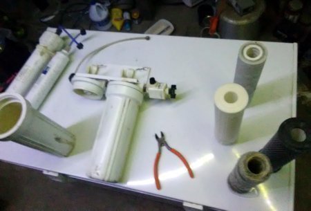 Changing filters in water purification system.